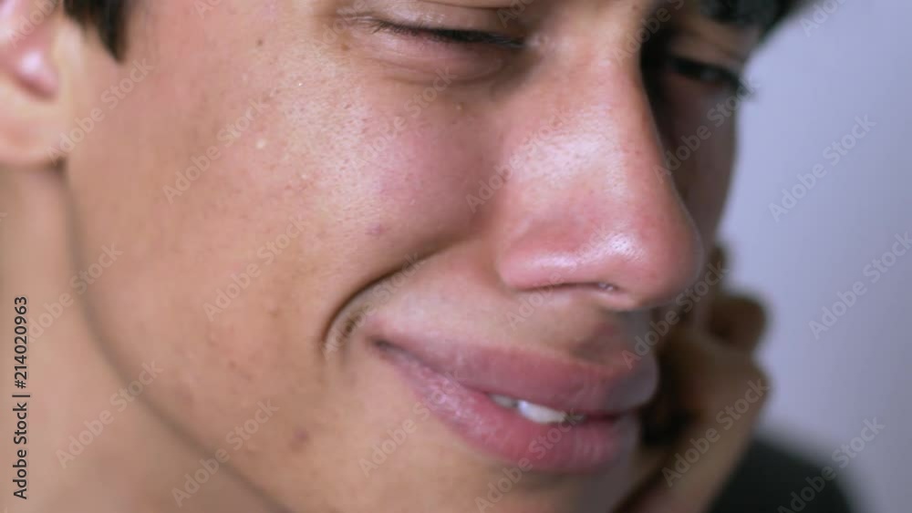 young man with a broken heart weeping desperately- close up young man with a broken heart weeping desperately- close up