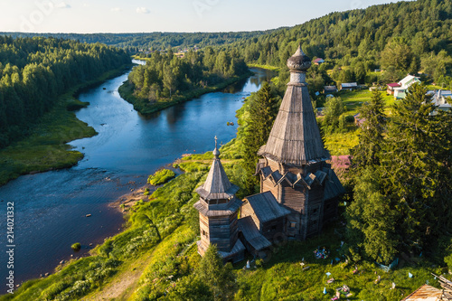 Bird's eye view of the Church of St. Nicholas (built 1696) in Soginicy village and Vazhinka river, Podporozhysky district. Green forests of Leningrad region and Republic of Karelia, Russia. photo