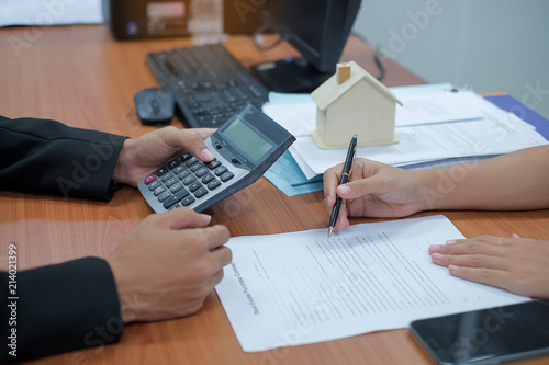 customer ready to signs home loan contract with real estate agent. successful agreement, housing purchase and insurance concepts