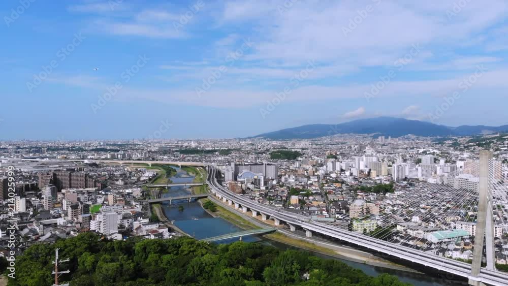 Takeoff over Japanese gate on hillside overlooking Ikeda on the northern edge of Osaka Takeoff over Japanese gate on hillside overlooking Ikeda on the northern edge of Osaka