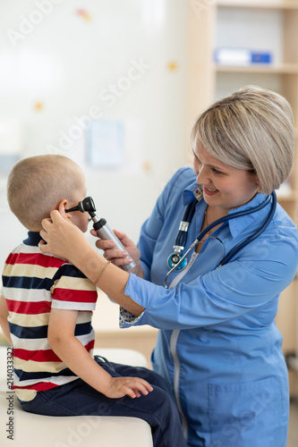 Doctor examining kid s ear