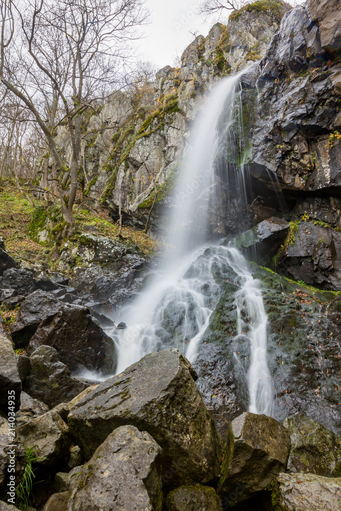 Blurred long exposure photograph of Boyanski waterfall, the Boyana river near Sofia, Bulgaria in fall, cold autumn day Blurred long exposure photograph of Boyanski waterfall, the Boyana river near Sofia, Bulgaria in fall, cold autumn day