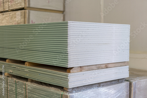 Pallet with plasterboard in the building store. Warehouse with plasterboard. sheets of plasterboard on pallets. Construction Materials. Drywall warehouse.