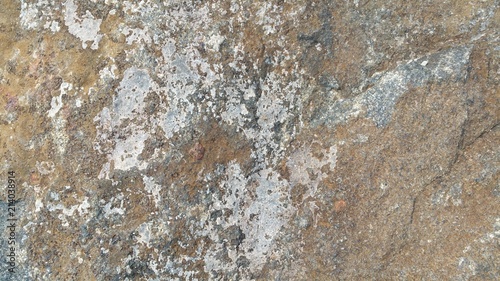 white paint worn from stone wall