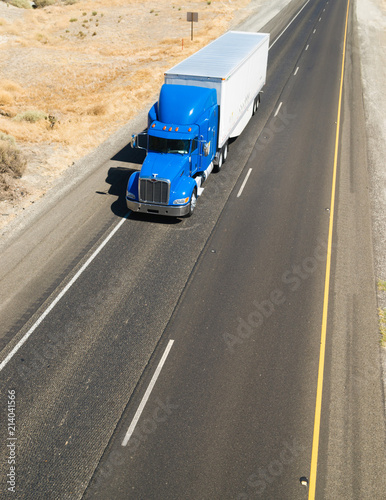 Big Blue Truck Hauling a Load of Freight down the Highway