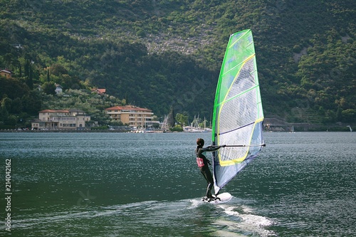 Girl windsurfing at Lake Garda (Torbole, Italy)