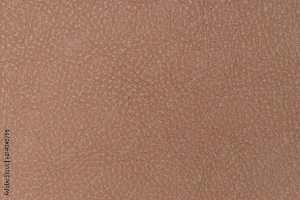 Light brown leather texture surface. Close-up of natural grain cow leather . Light brown leather texture surface. Close-up of natural grain cow leather .