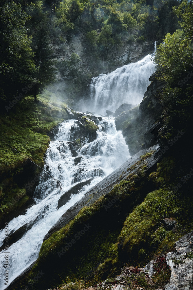 Waterfall in forest at Lenteney Valle D'Aosta