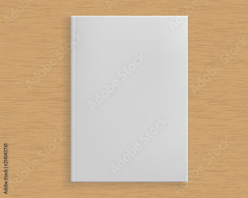 Realistic white book in hard case on wooden board table with texture - with copy space