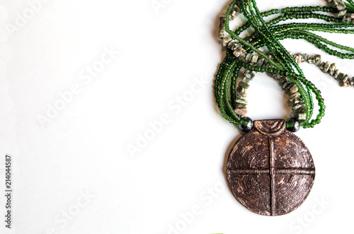 African fashion traditional ethnic beads jewelry necklace with metal buckle in green tint. photo