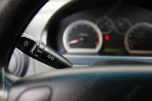 Lever control light in the car with a dark gray dashboard