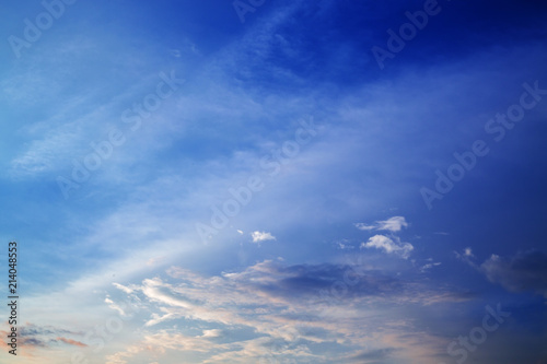 Blue sky with clouds and sun.