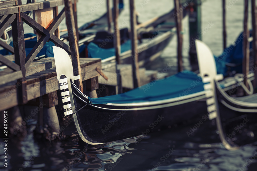 Traditional gondolas of Venice docked in the harbor Traditional gondolas of Venice docked in the harbor