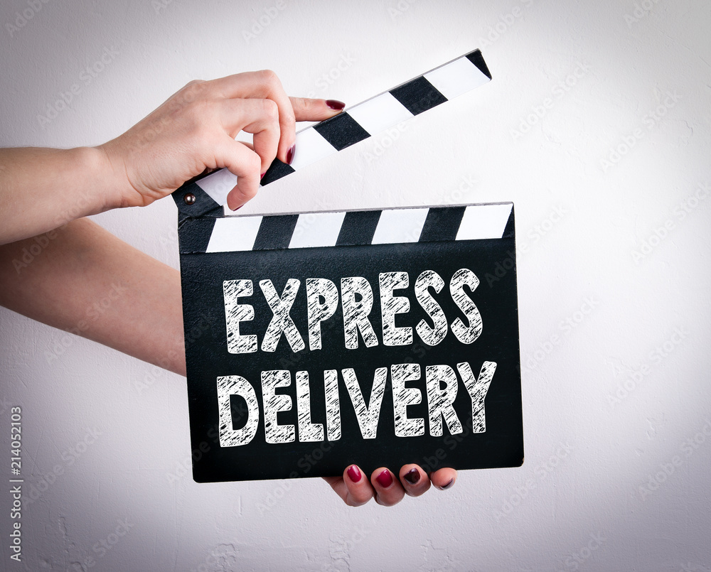 Express Delivery for online shopping. Worldwide shipping. Female hands holding movie clapper