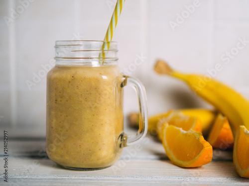 A banana orange smoothie. Healthy milkshake