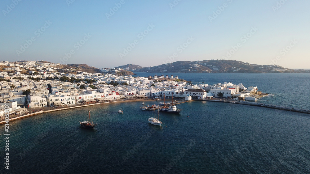 Aerial photo of iconic and traditional whitewashed old port of Mykonos island at sunset, Cyclades, Greece