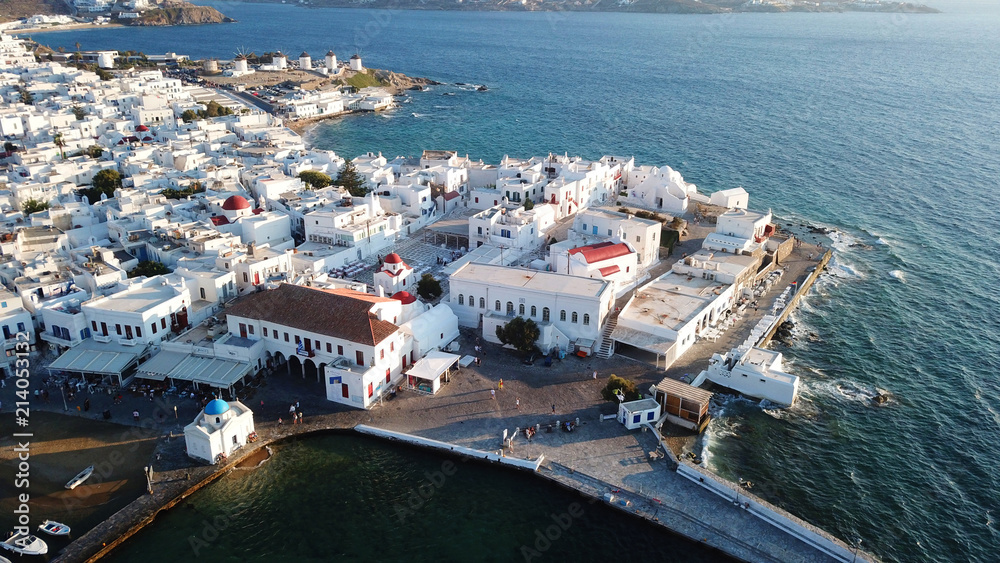 Aerial photo of iconic and traditional whitewashed old port of Mykonos island at sunset, Cyclades, Greece