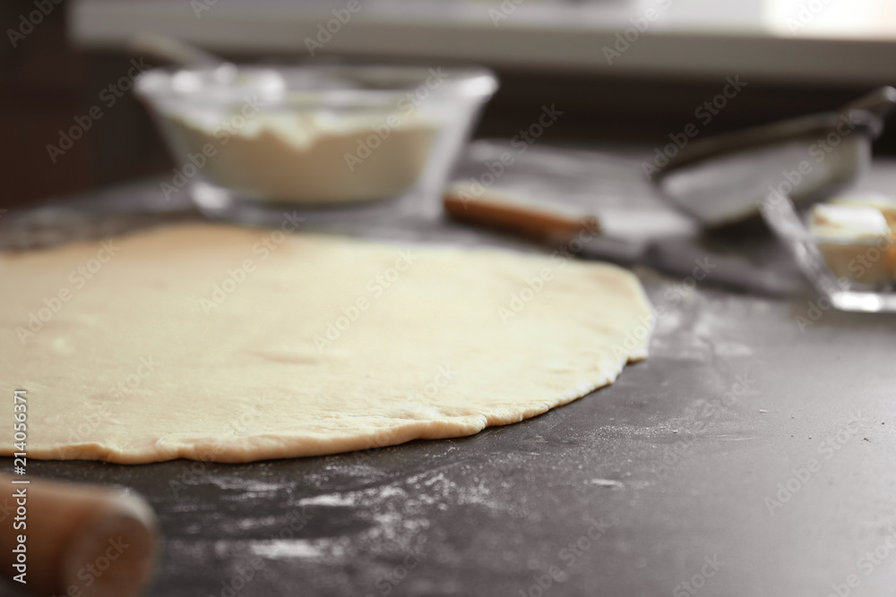 Raw dough on kitchen table. Baking workshop Raw dough on kitchen table. Baking workshop