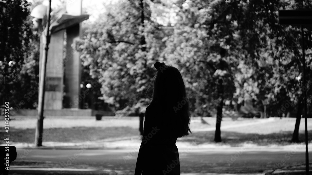 Shilouette girl in park