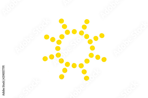 dotted sun symbol on white background with copy space