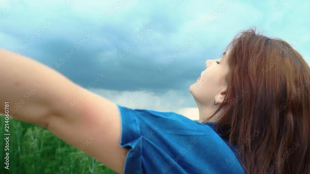 A girl without a medical mask inhales fresh air. The end of the epidemic. Victory over the virus. Young woman on the background of a distant big city. Stop coronavirus. Fusion with nature, meditation. A girl without a medical mask inhales fresh air. The end of the epidemic. Victory over the virus. Young woman on the background of a distant big city. Stop coronavirus. Fusion with nature, meditation.