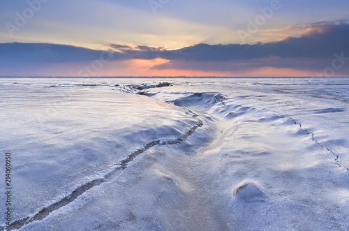 Sunset on the frozen North Sea, Lower Saxony, Germany, Europe