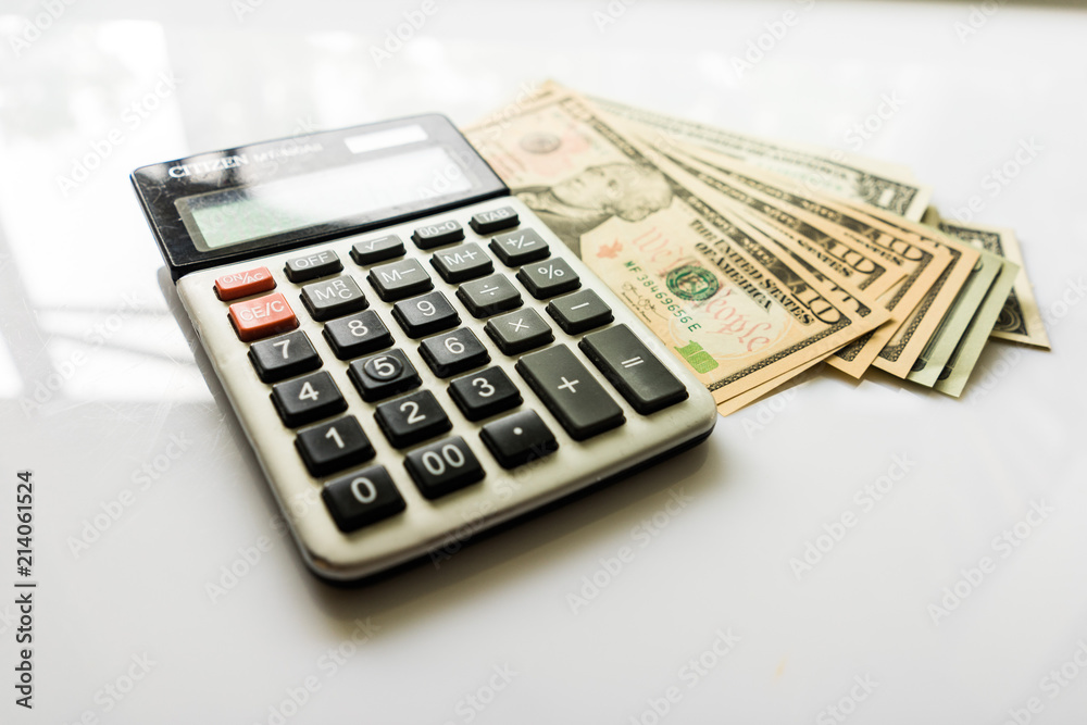 Close-up Money and Calculator, American Dollar Banknotes Close-up Money and Calculator, American Dollar Banknotes
