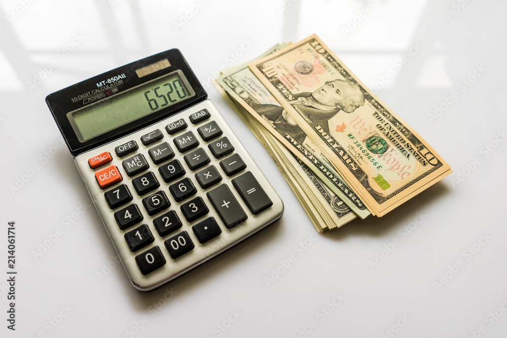 Close-up Money and Calculator, American Dollar Banknotes Close-up Money and Calculator, American Dollar Banknotes