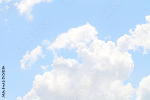 Blue sky with white beautiful clouds. The texture of natural phenomena, cloudiness on a clear sunny day. © Nadzeya Pakhomava