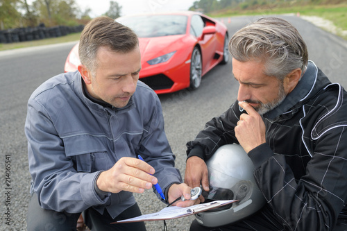 giving instructions to a car racer © auremar