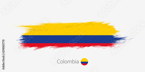 Flag of Colombia, grunge abstract brush stroke on gray background.
