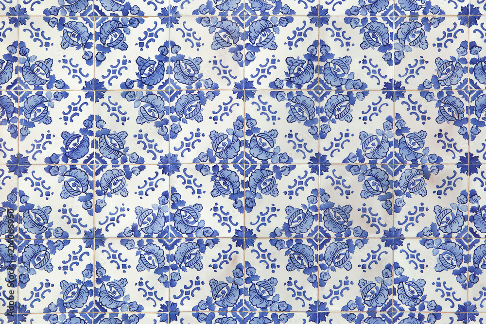 Traditional Portuguese azulejo tiles on the building in Porto, Portugal.