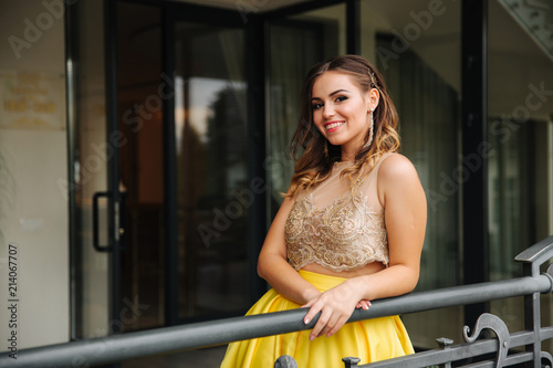 Happy smiling woman in amazing evening dress