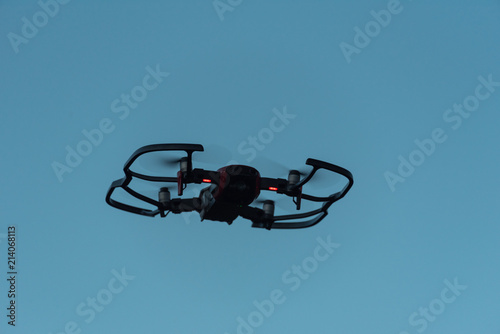 Quadrocopter against the background of the evening sky