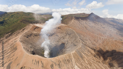 Crater with active volcano smoke in East Jawa, Indonesia. Aerial view of volcano crater Mount Gunung Bromo is an active volcano,Tengger Semeru National Park.