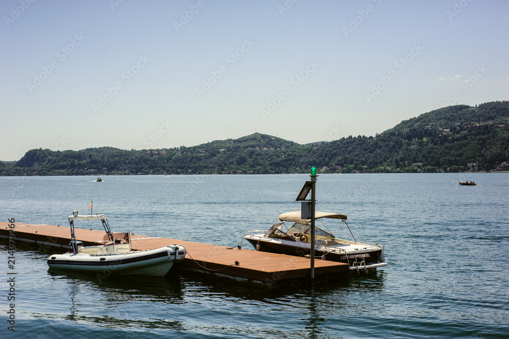 motorboats moored at the pier, lake maggiore italy