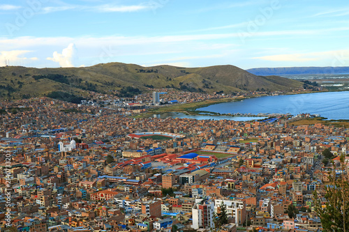 Aerial View of Puno Cityscape and Lake Titicaca as Seen from the Condor Hill View Point, Puno, Peru  photo