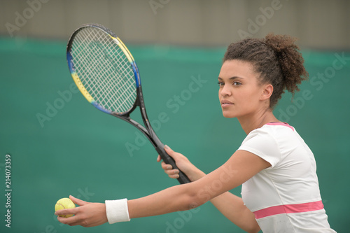 female tennis player on the court © auremar