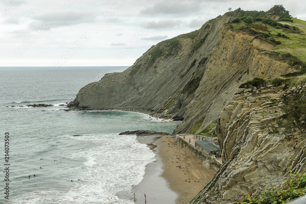 cliffs with flysch stratotypes on the beach of itzurun in Zumaia in the Basque Country, in the north of Spain.