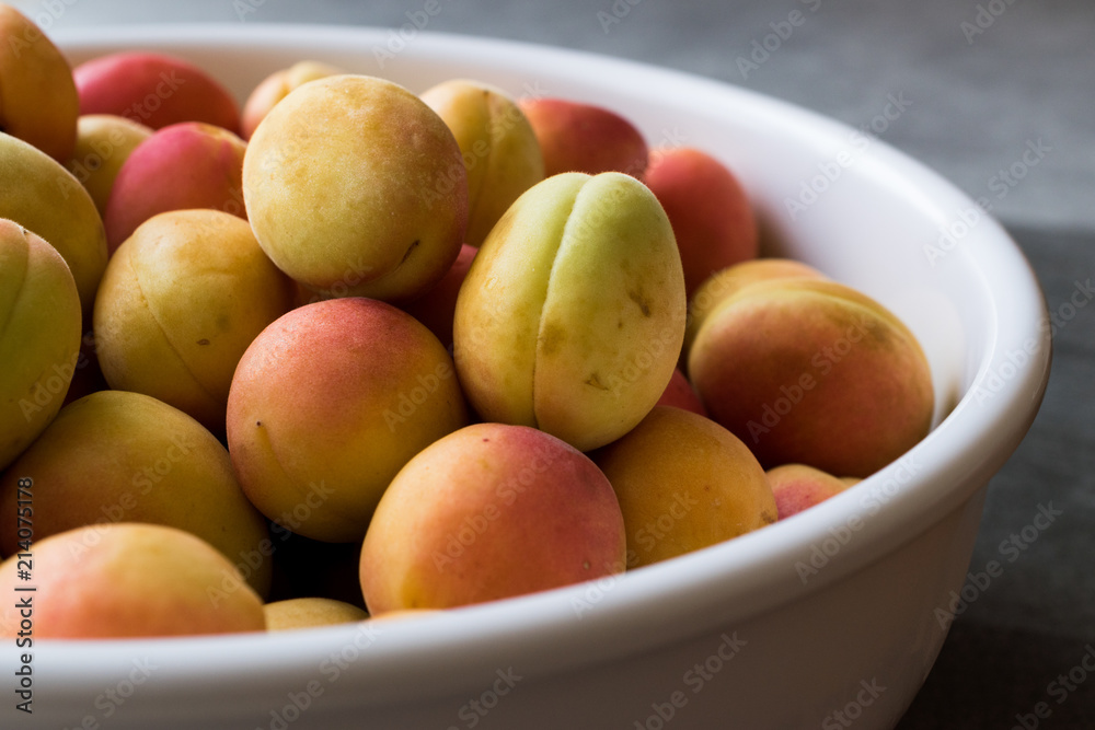 Raw Ripe Organic Orange Pile of Apricots in Big Bowl. Raw Ripe Organic Orange Pile of Apricots in Big Bowl.