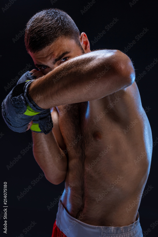 Double arm block. Boxing trainer showing defensive techniques. Combat sport, fight club. Double arm block. Boxing trainer showing defensive techniques. Combat sport, fight club.