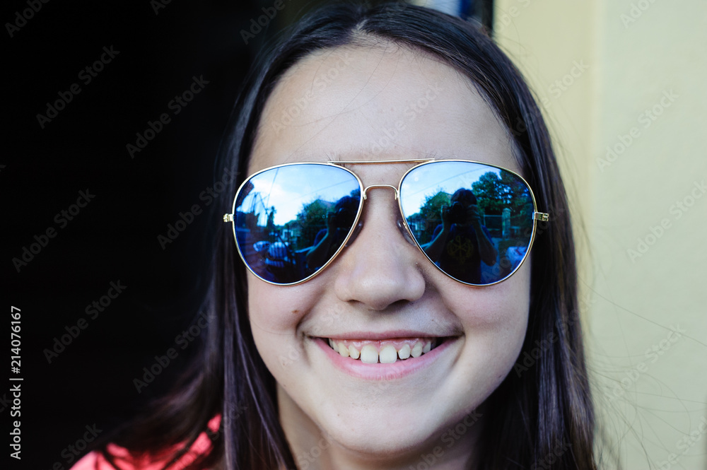 portrait of teen ager with mirrored glasses portrait of teen ager with mirrored glasses