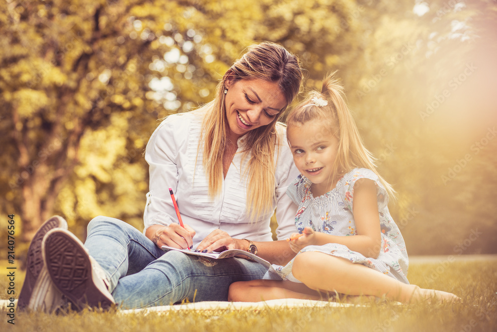 Fototapeta premium Family time. Mother and daughter at public park.