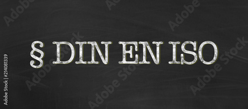 DIN EN ISO for german, european and international standard organization with chalk on blackboard background as banner