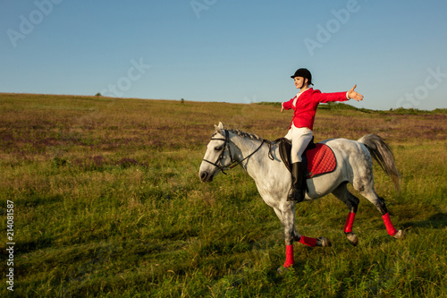 The horsewoman on a red horse. Horse riding. Horse racing. Rider on a horse. © nazarovsergey