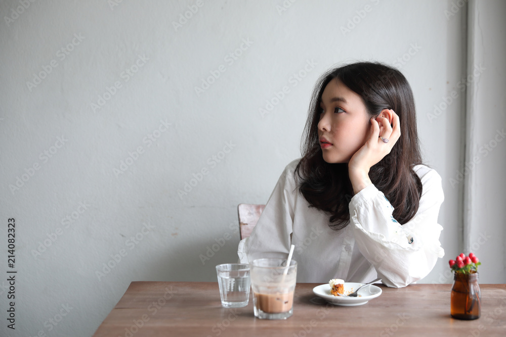 Portrait of young woman looking in coffee shop modern life style Portrait of young woman looking in coffee shop modern life style