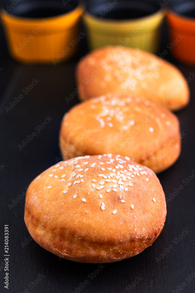 Food concept Homemade Organic bun Hamburger on black slate plate with copy space Food concept Homemade Organic bun Hamburger on black slate plate with copy space