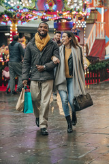 Happy Couple Walking Arm in Arm