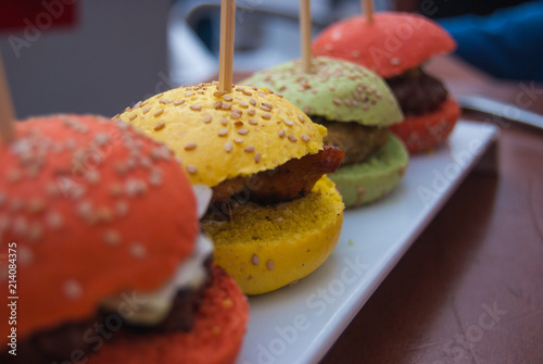 Four colorful and mini hamburgers