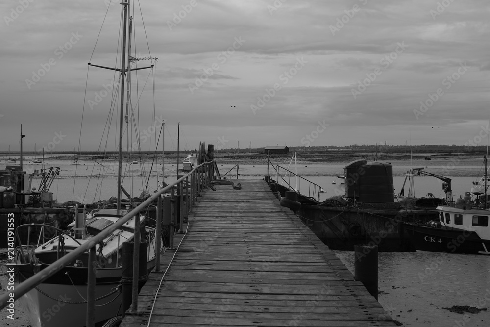 Fototapeta premium Fishing Port / Village with Boats by the Dock on a Cloudy Day
